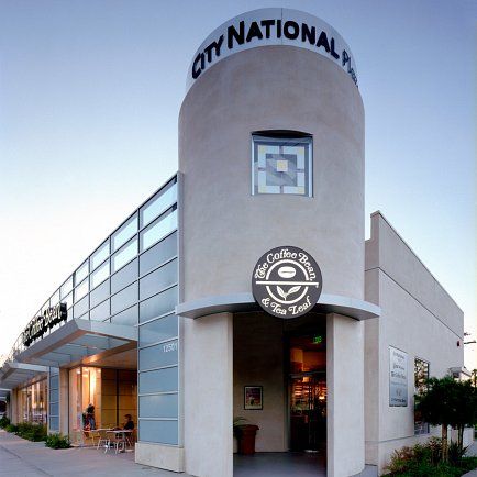 Building showcasing modern architecture and vibrant cultural activities in a bustling urban setting.