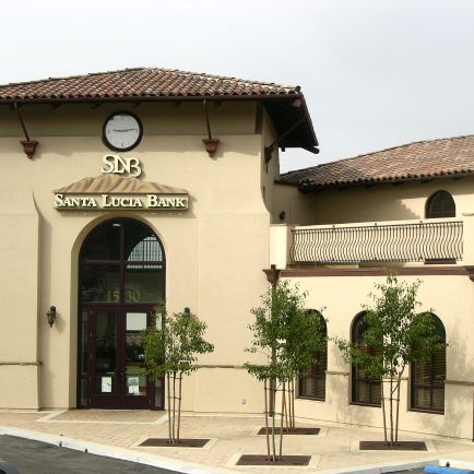 A large building featuring a prominent clock on its facade, showcasing architectural elegance and historical significance.